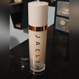 Jaclyn White and Gold Cosmetic Bottle